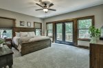 Main level master bedroom with deck access